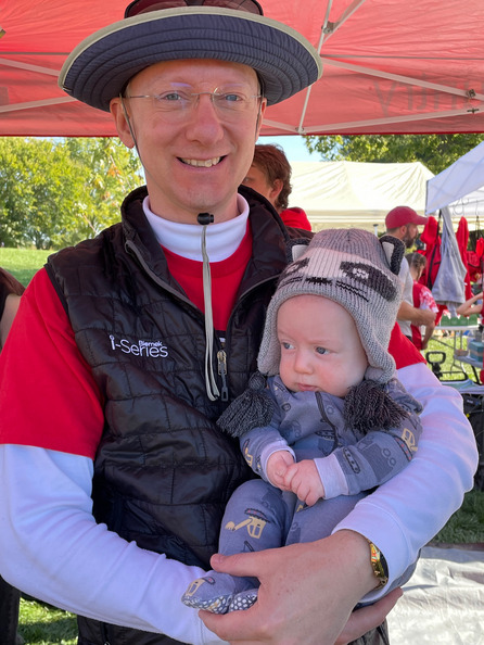 Holding Theo at the cross-country championship
