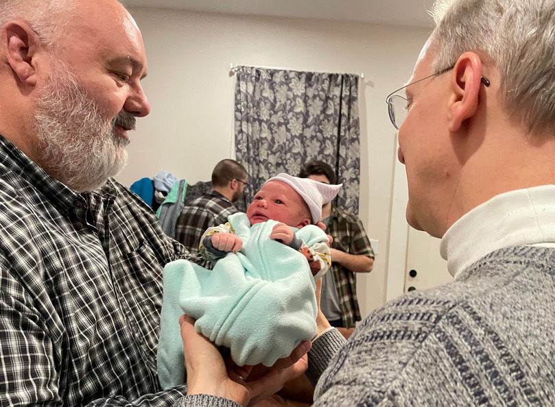 Both grandpas holding one-day-old Steven Mitchell