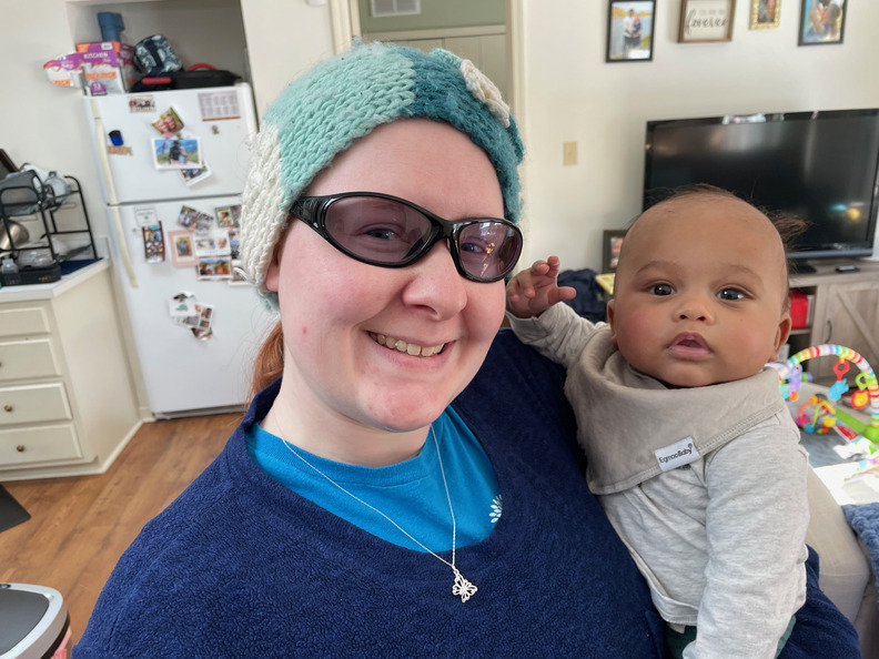 Elizabeth holding Obadiah for the first time