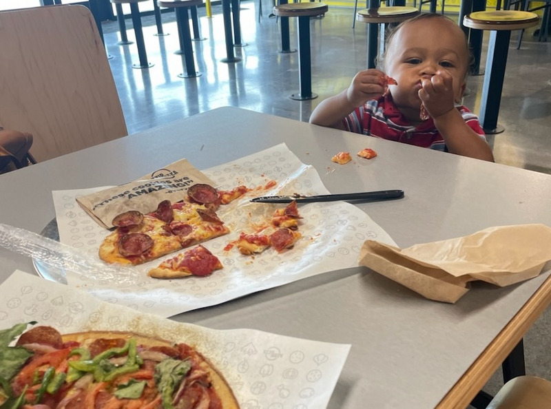 Enjoying pizza