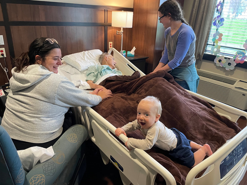 Rebecca, Ruth & Theo caring for Grandpa Ron at Franciscan Hospice House