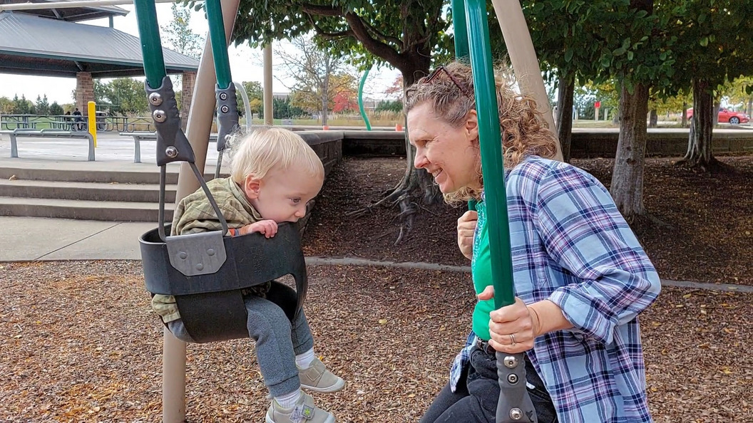 Theo teething on the swing