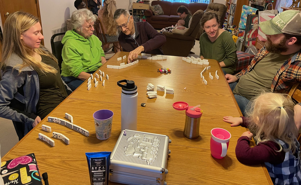Grandpa Ron teaching my mom how to play Mexican Train