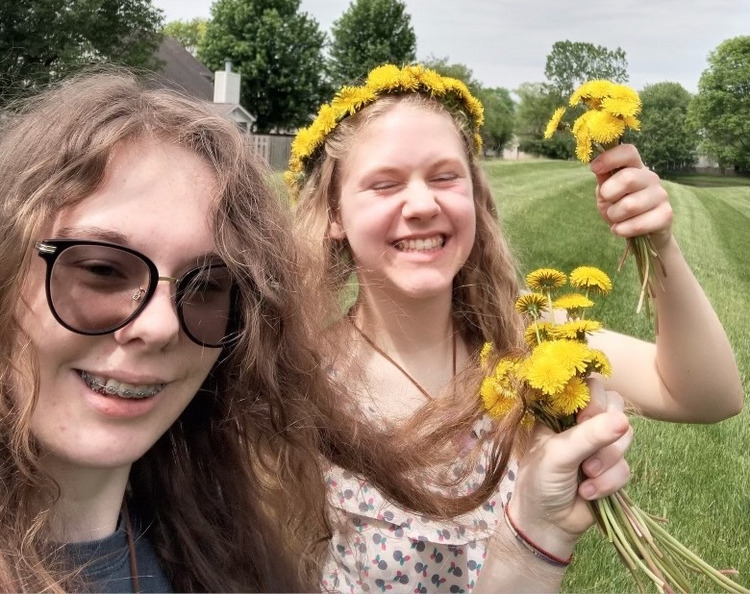 Making dandelion crowns with Alexis