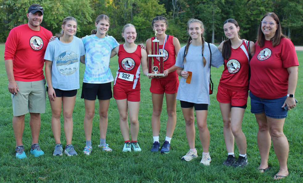 Girls cross-country team with our first-place trophy